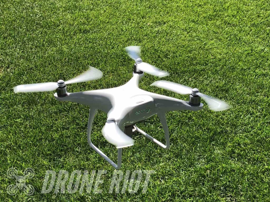 White drone taking off drone takeoff