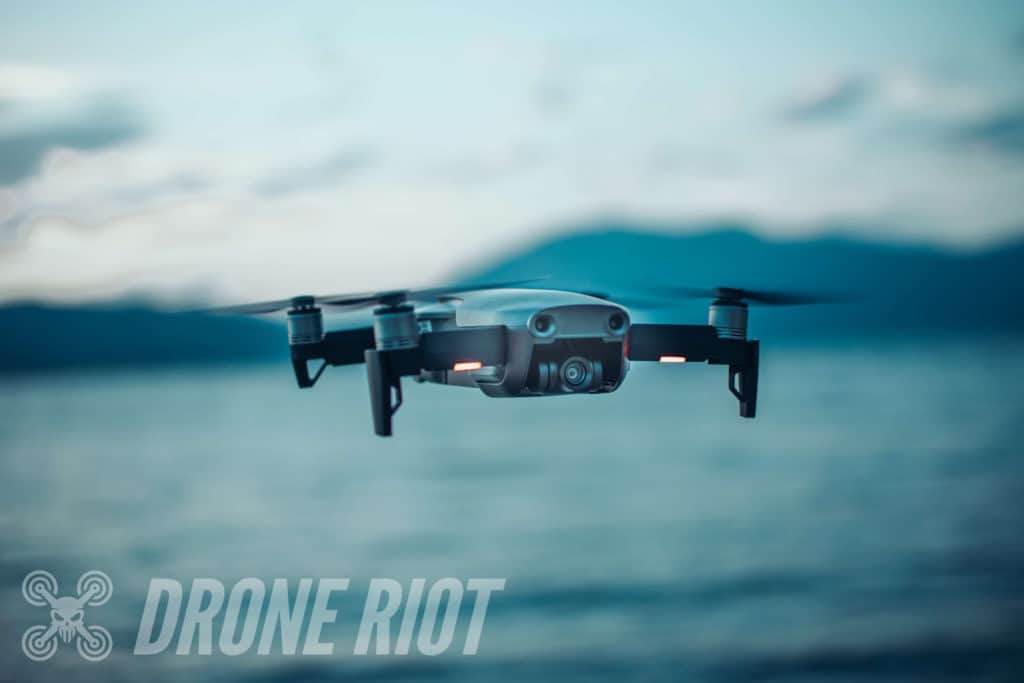 Mavic Air flying over water Drone flying past lake